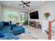 Comfortable living room with a sectional sofa and large TV at 9107 Carolina Wren Dr, Tampa, FL 33626