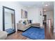 Spacious loft area with sectional sofa and large mirror at 9107 Carolina Wren Dr, Tampa, FL 33626