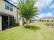 Private backyard with screened patio and pond view at 9107 Carolina Wren Dr, Tampa, FL 33626