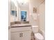 Clean bathroom with single sink vanity and tub at 9107 Carolina Wren Dr, Tampa, FL 33626