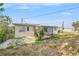 Spacious backyard featuring a patio area and a storage shed at 10735 64Th N Ave, Seminole, FL 33772