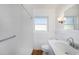 Bathroom featuring white tiling, and a walk-in shower at 10735 64Th N Ave, Seminole, FL 33772