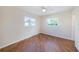 Bedroom boasting wood floors and natural light from two windows at 10735 64Th N Ave, Seminole, FL 33772
