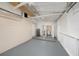 Clean garage with painted walls, utility sink, washer, and dryer hook-ups at 10735 64Th N Ave, Seminole, FL 33772