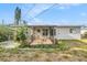 Charming screened-in patio with garden area, perfect for enjoying the outdoors in comfort at 10735 64Th N Ave, Seminole, FL 33772