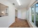 Bright sunroom with wood floors and multiple windows overlooking the backyard at 10735 64Th N Ave, Seminole, FL 33772
