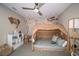 bedroom with a tent bed, world map mural, and built-in shelving at 3911 Farm Garden Ct, Lakewood Ranch, FL 34211