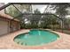 Screened pool with brick pavers surrounding at 4969 Kilkenney Way, Oldsmar, FL 34677