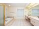 Primary bathroom with double vanity, soaking tub and shower at 4969 Kilkenney Way, Oldsmar, FL 34677