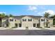 Three-unit townhome building with attached garages and landscaping at 17216 Bigleaf Mahogany Ln, Land O Lakes, FL 34638