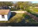 This aerial view shows the large fenced-in backyard, giving the home additional privacy at 3010 E 149Th Ave, Lutz, FL 33559