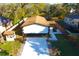 A high-angle shot reveals a well-kept home, a fenced-in yard and a newly-paved driveway at 3010 E 149Th Ave, Lutz, FL 33559