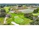 Golf course with green and sand trap at 13400 Norman Cir, Hudson, FL 34669