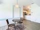 Bright breakfast nook with small table and chairs, near kitchen at 13400 Norman Cir, Hudson, FL 34669