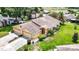 Aerial view of a single-Gathering home with a two-car garage and a large backyard at 13400 Norman Cir, Hudson, FL 34669