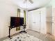Bedroom with a flat screen TV, and neutral decor at 13400 Norman Cir, Hudson, FL 34669