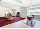 Bright living room with a view, featuring hardwood floors and ample natural light at 13400 Norman Cir, Hudson, FL 34669