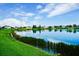 Stunning view of a lake with houses in the background at 331 Star Shell Dr, Apollo Beach, FL 33572