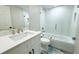 Clean bathroom with white vanity, bathtub and blue tile floor at 3010 E 149Th Ave, Lutz, FL 33559