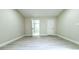 Spacious bedroom with an ensuite bathroom and new flooring at 3010 E 149Th Ave, Lutz, FL 33559