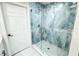 Large walk-in shower with blue tile and glass enclosure at 3010 E 149Th Ave, Lutz, FL 33559