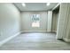 Bedroom with a large window, new flooring, and ample closet space at 3010 E 149Th Ave, Lutz, FL 33559
