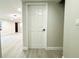 Clean hallway with new flooring, leading to other rooms at 3010 E 149Th Ave, Lutz, FL 33559