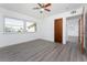 Simple bedroom with wood-look floors at 29171 Orva Dr, Punta Gorda, FL 33982