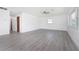 Spacious living room with wood-look floors and lots of light at 29171 Orva Dr, Punta Gorda, FL 33982