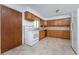 Kitchen with wood cabinets, white appliances, and tile floor at 29171 Orva Dr, Punta Gorda, FL 33982