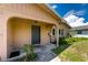 Inviting house exterior with a covered porch and well-maintained landscaping at 29171 Orva Dr, Punta Gorda, FL 33982