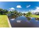 Peaceful waterfront view showcasing a canal and lush greenery at 29171 Orva Dr, Punta Gorda, FL 33982