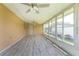 Bright Florida room with wood-look floors and large windows at 29171 Orva Dr, Punta Gorda, FL 33982