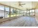 Bright sunroom with view of backyard and water at 29171 Orva Dr, Punta Gorda, FL 33982