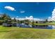Scenic view of a calm canal with homes along the water's edge at 29171 Orva Dr, Punta Gorda, FL 33982
