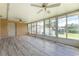 Spacious sunroom with wood-look flooring and plenty of natural light at 29171 Orva Dr, Punta Gorda, FL 33982