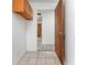 Bright laundry room with tile floor and built-in cabinets at 29171 Orva Dr, Punta Gorda, FL 33982