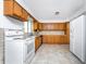 Kitchen with wood cabinets and appliances at 29171 Orva Dr, Punta Gorda, FL 33982