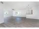 Spacious living room featuring hardwood floors and ample natural light at 29171 Orva Dr, Punta Gorda, FL 33982