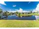 Tranquil canal-front property with lush landscaping and a spacious yard at 29171 Orva Dr, Punta Gorda, FL 33982