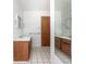 Bright bathroom with double vanity and tiled floor at 29171 Orva Dr, Punta Gorda, FL 33982