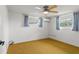 Spacious bedroom with neutral walls, carpet flooring, and ample natural light at 7015 Flaggler Dr, Port Richey, FL 34668