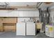 Laundry room with washer, dryer, utility sink, and ample cabinet space at 7015 Flaggler Dr, Port Richey, FL 34668