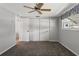 Spacious bedroom with double closets and fan at 7015 Flaggler Dr, Port Richey, FL 34668