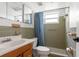 Clean bathroom with shower/tub combo, tile flooring, and single vanity at 7015 Flaggler Dr, Port Richey, FL 34668