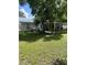 Large backyard with grassy area and playset at 37353 Lea Ave, Zephyrhills, FL 33541