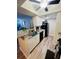 Modern kitchen with white cabinets, granite countertops, and black appliances at 10200 Gandy Blvd # 1116, St Petersburg, FL 33702