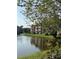 Serene lakefront view of the community with lush landscaping at 10200 Gandy Blvd # 1116, St Petersburg, FL 33702