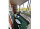 Screened-in patio with seating area and artificial turf at 10200 Gandy Blvd # 1116, St Petersburg, FL 33702