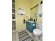 Cozy bathroom with a blue vanity and decorative accents at 761 Tremont Greens Ln # 61, Sun City Center, FL 33573
